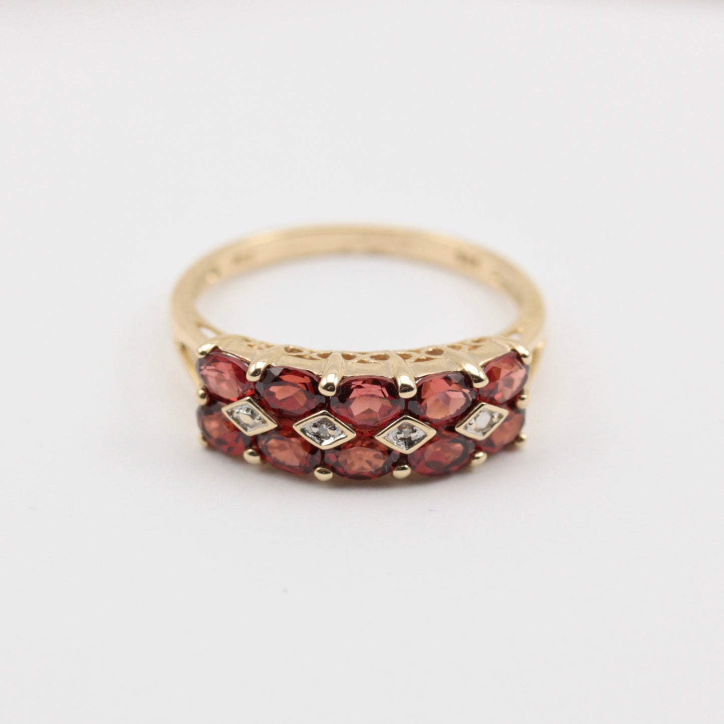 pre-owned garnet and diamond ring