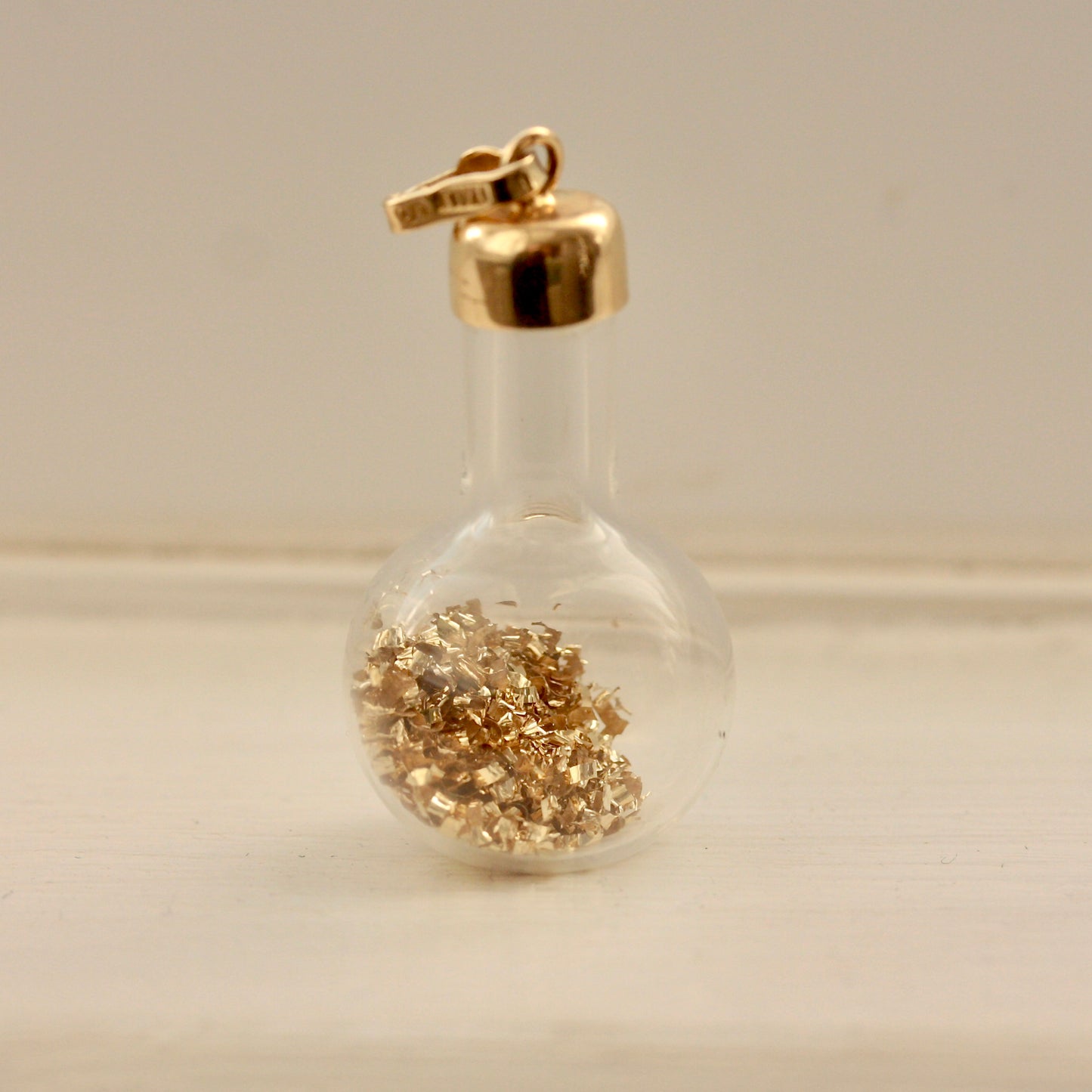 vintage 14k gold flakes in bottle charm