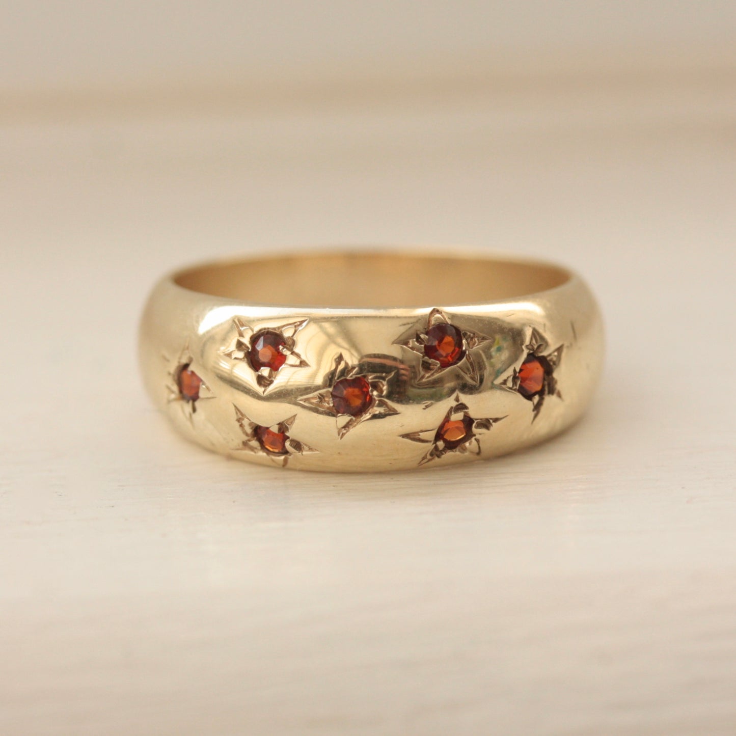 Vintage 9ct Gold Domed Ring with Star Set Garnets