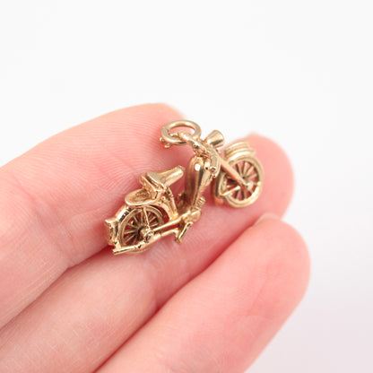 vintage 9ct gold motorbike charm with articulated wheels