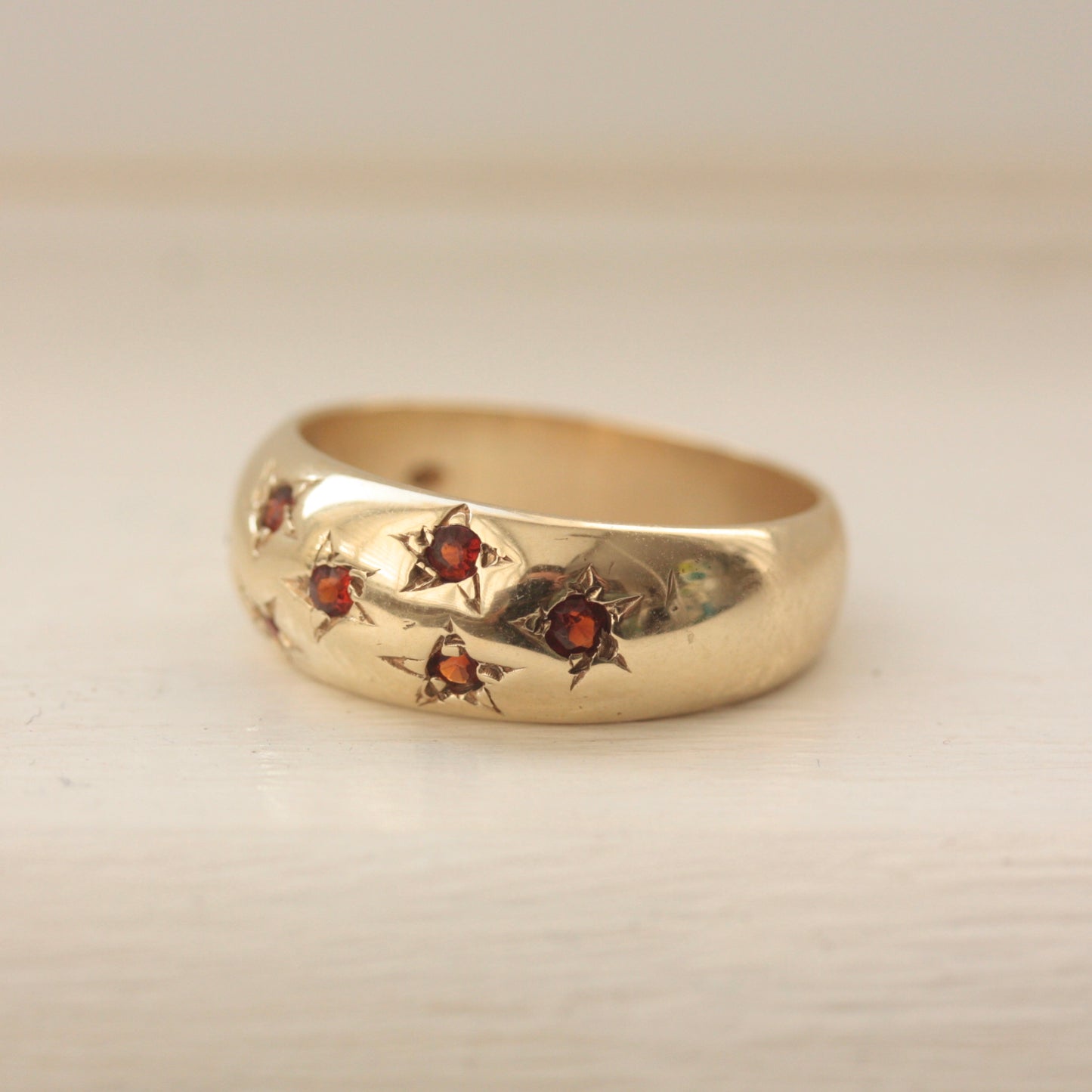 Vintage 9ct Gold Domed Ring with Star Set Garnets