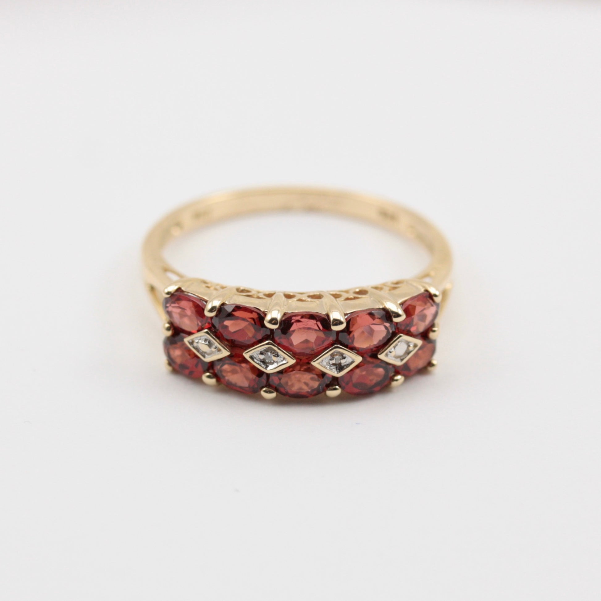 pre-owned garnet and diamond ring