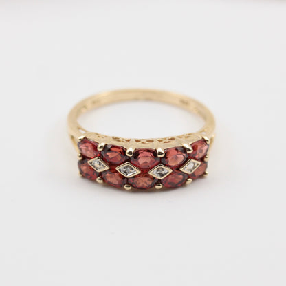 pre-owned garnet and diamond ring