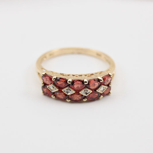 pre-owned garnet and diamond ring