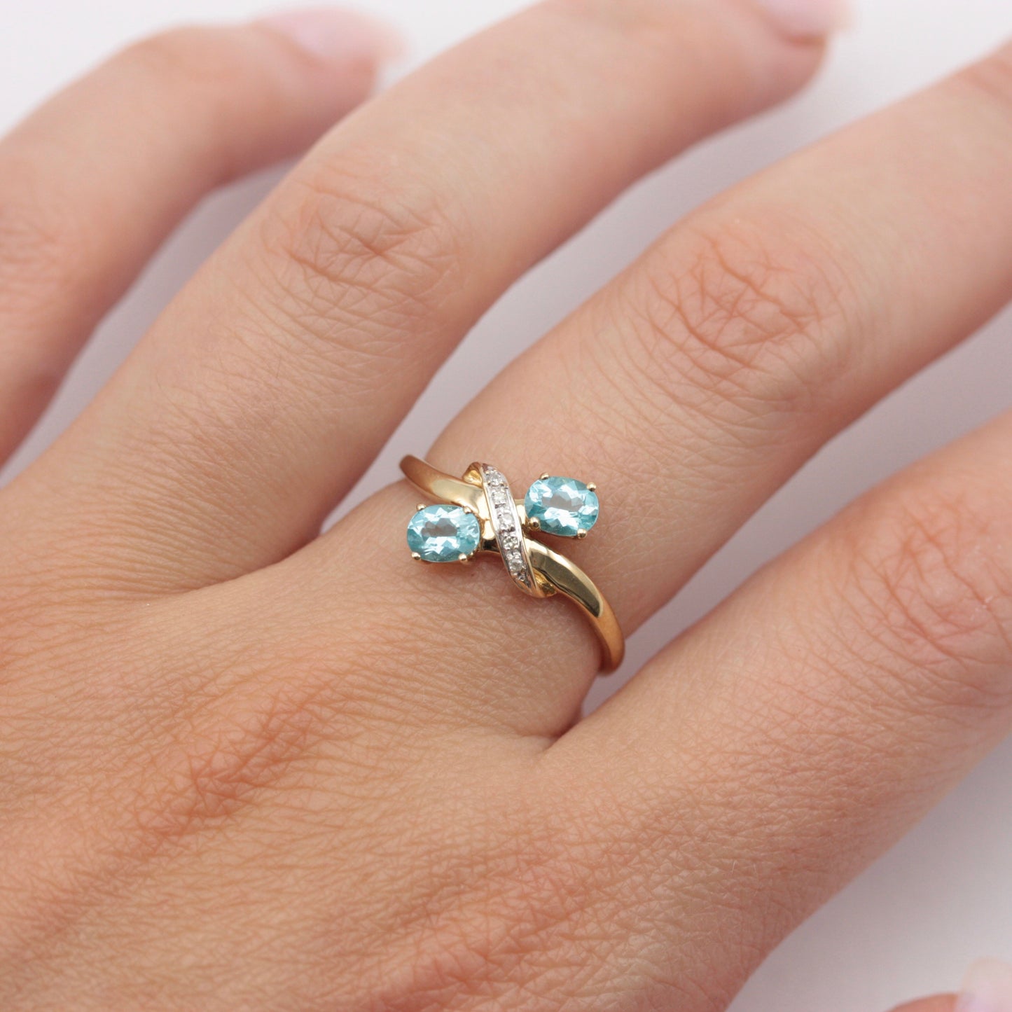 Pre-owned 9ct Gold Crossover Ring with Diamonds & Topaz Blue CZ