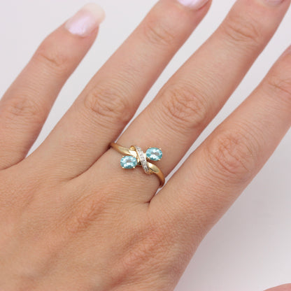 Pre-owned 9ct Gold Crossover Ring with Diamonds & Topaz Blue CZ