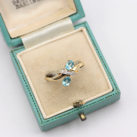 Pre-owned 9ct Gold Crossover Ring with Diamonds & Topaz Blue CZ
