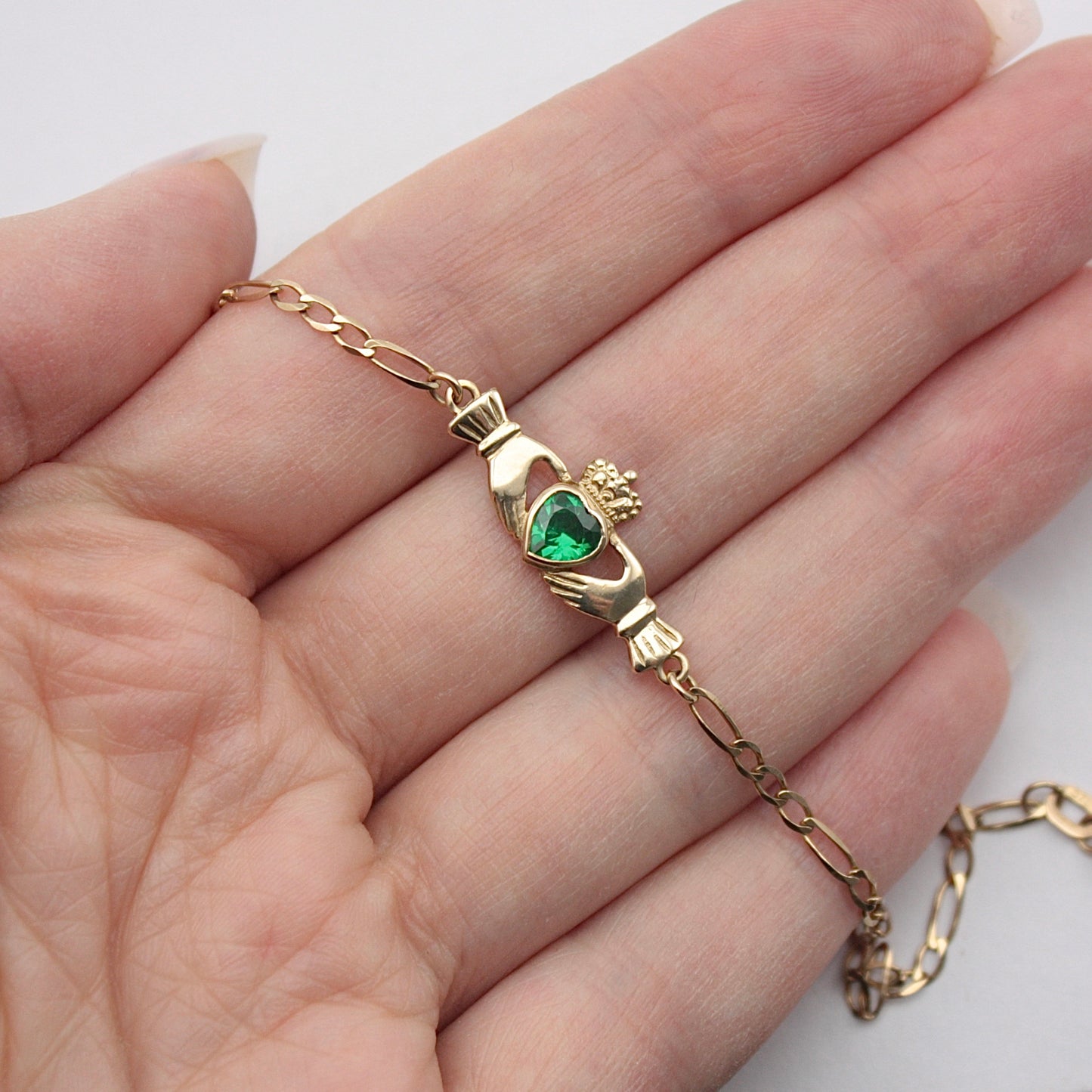 Pre-owned 9ct Gold Claddagh Figaro Bracelet with Green CZ