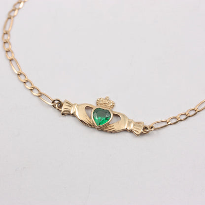 Pre-owned 9ct Gold Claddagh Figaro Bracelet with Green CZ