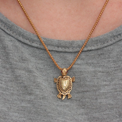 Vintage Articulated Turtle Pendant with Enamel Shell and Ruby Eyes