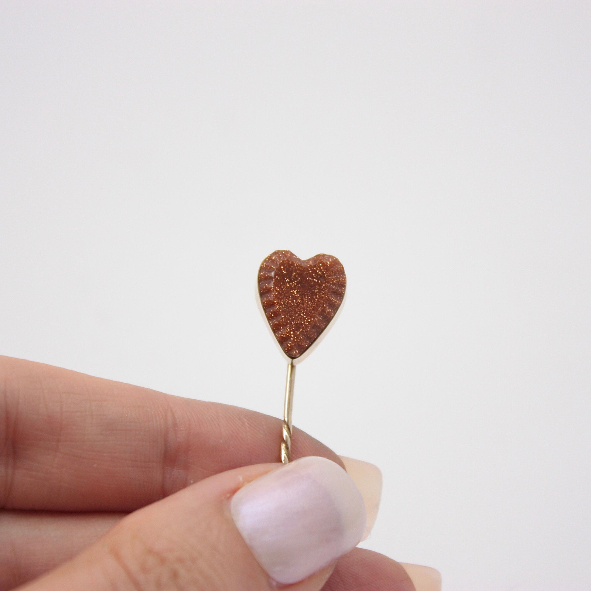 antique gold goldstone heart stick pin