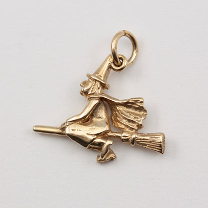 pre-owned 9ct gold witch on broom charm