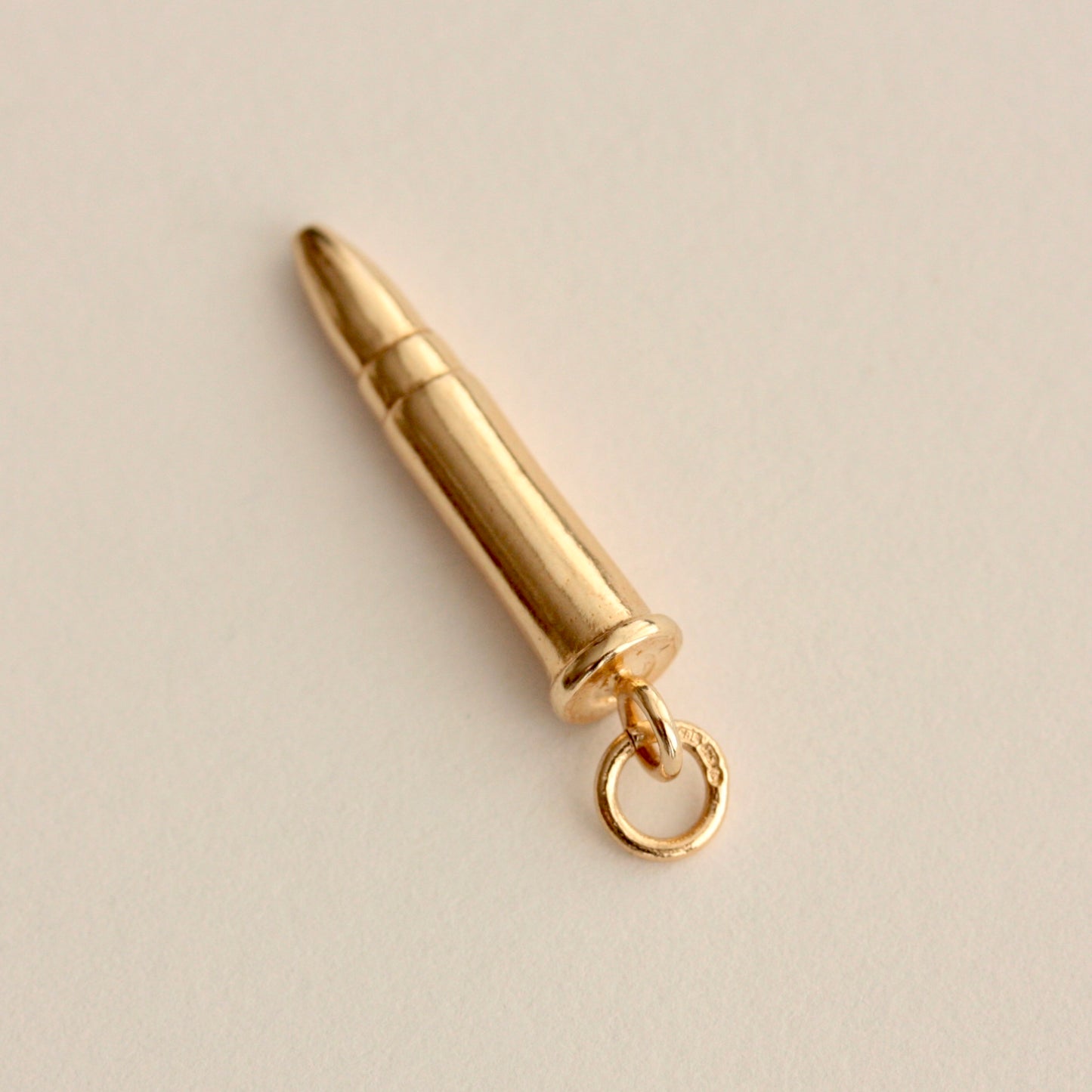 pre owned gold bullet charm