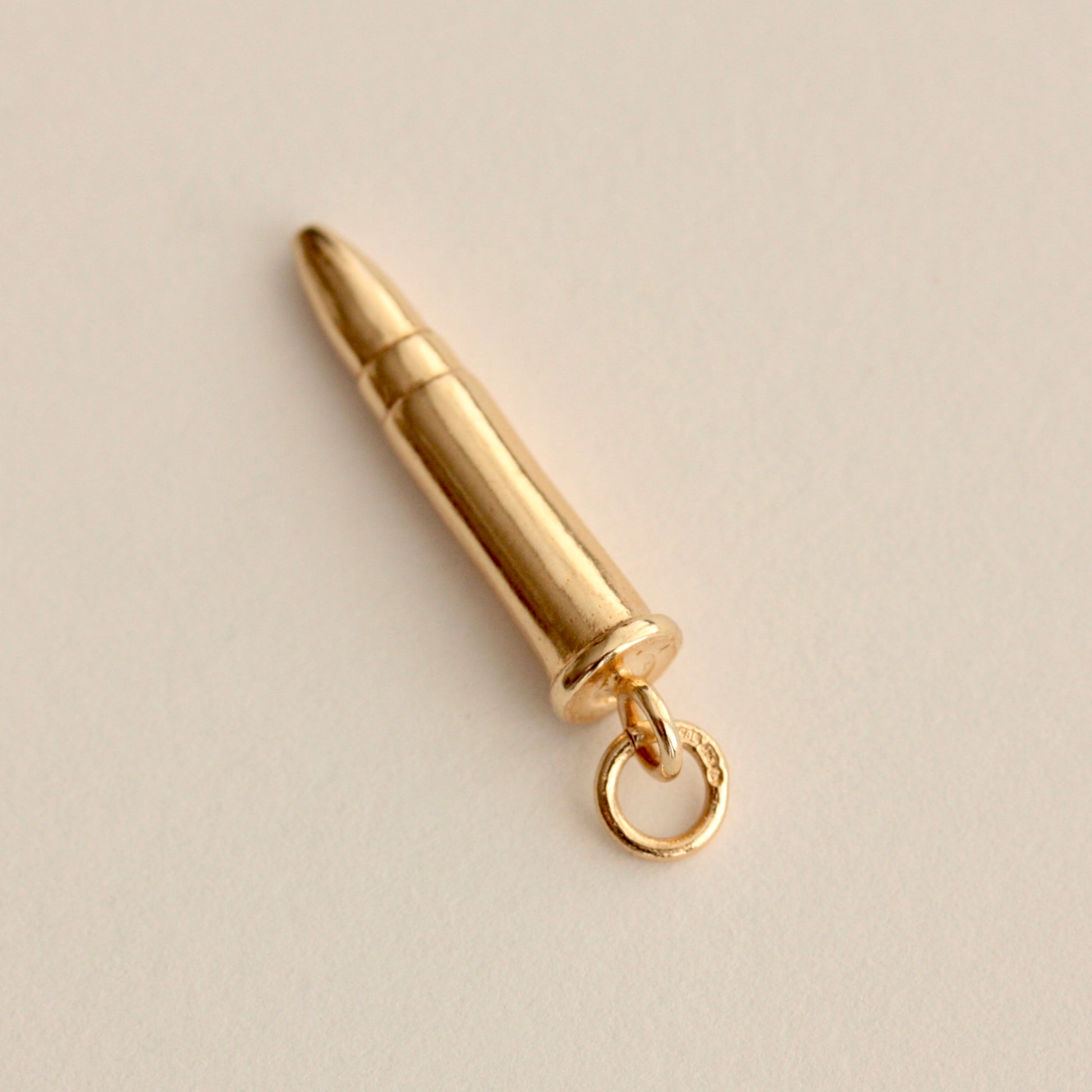 pre owned gold bullet charm