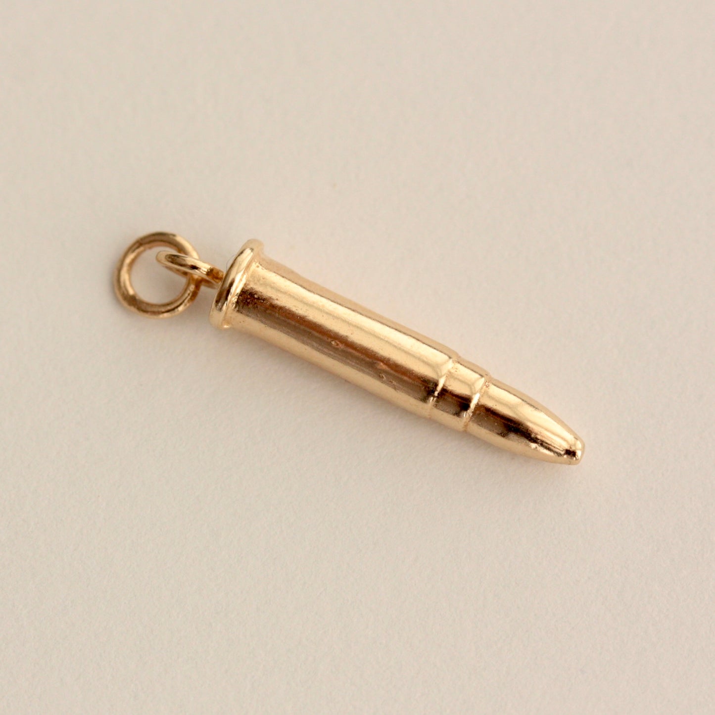 vintage gold bullet charm