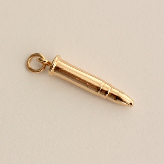 vintage gold bullet charm