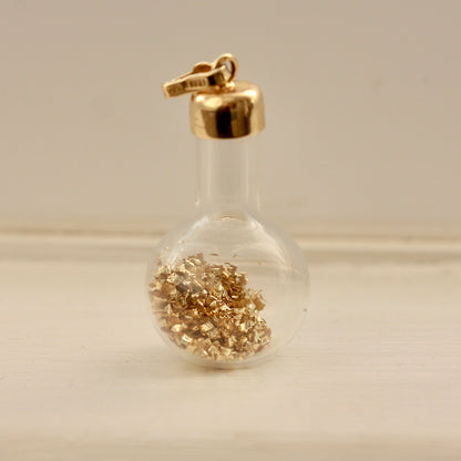 vintage 14k gold flakes in bottle charm