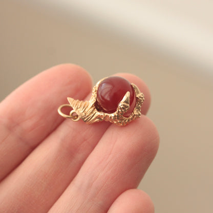 Vintage 1960s gold claw holding ball charm