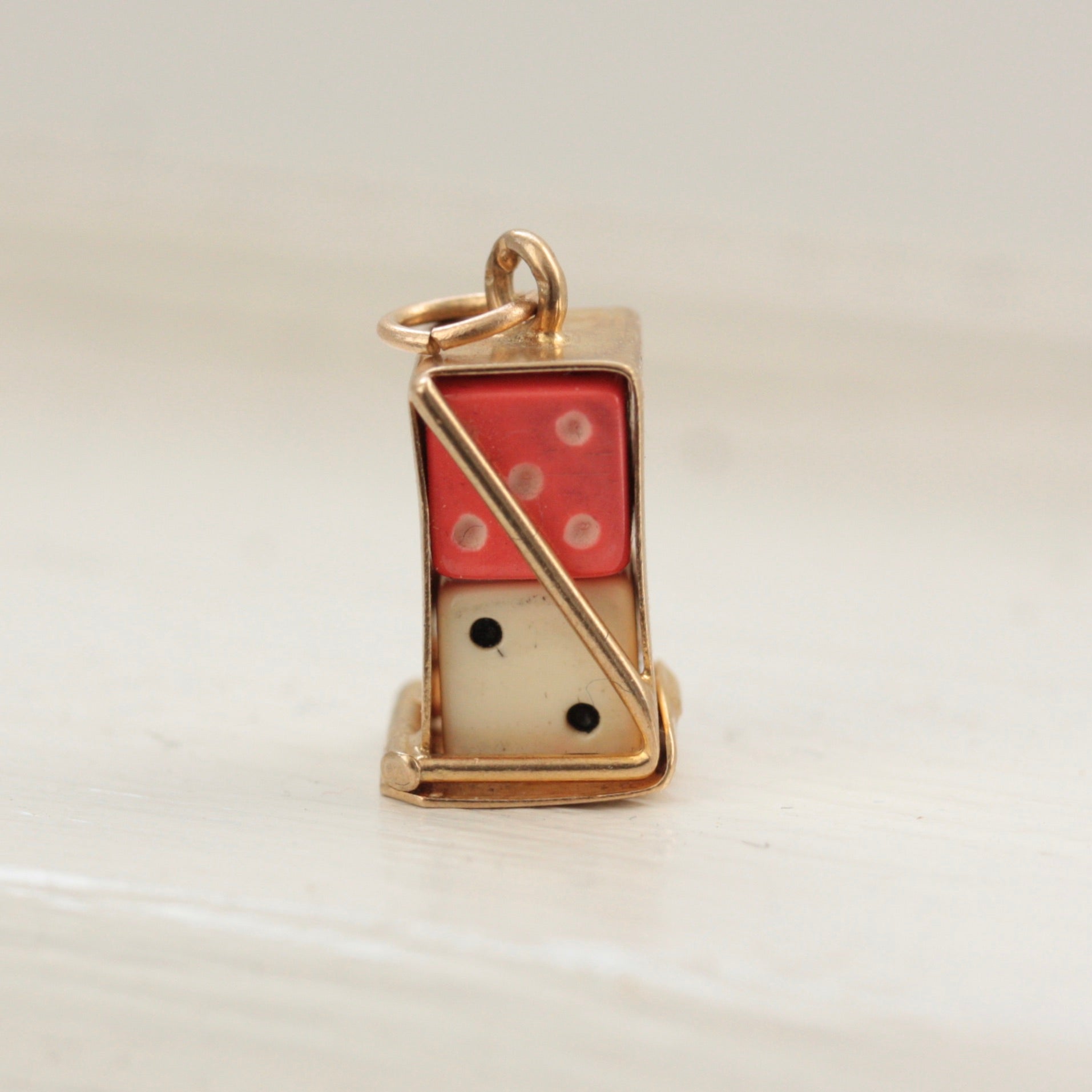 vintage gold boxed dice charm